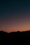 Silhouette of a hill on the twilight with the waxing crescent