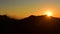 Silhouette of Himalayan mountain ranges and hills as the sun rises, viewed from the summit of Poon Hill, Nepal