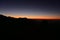 Silhouette of Himalayan mountain ranges and hills as the sun rises, viewed from the summit of Poon Hill, Nepal