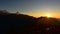 Silhouette of Himalayan mountain ranges and hills as the sun rises, viewed from the summit of Poon Hill, Nepal