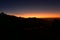 Silhouette of Himalayan mountain ranges and hills as the sun rises, viewed from the summit of Poon Hill, Nepal