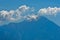 Silhouette of the holy mountains Athos and a small cloud above the mountain top, Chalkidiki