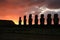 Silhouette of huge Moai statues of Ahu Tongariki against beautiful sunrise cloudy sky, Archaeological site in Easter Island