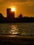 Silhouette image of beautiful seascape scenery with near town during sunset at Tanjung Lipat beach,Sabah.