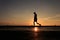 Silhouette Image of man walking on the helideck