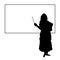 Silhouette Indian woman teacher in front of blackboard.