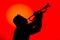 Silhouette of a jazz musician  playing trumpet, isolated in red background. Jazz music concept