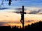 Silhouette of Jesus on a cross during sunset