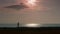 Silhouette jogger man on the beach. Athletic young person running nature during sunset along seashore. Outdoor cross country train