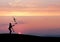 Silhouette of juggler in sunset