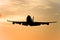 Silhouette of jumbo jet in flight.