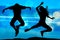Silhouette of jumping teenagers