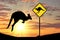 Silhouette of a kangaroo with a baby