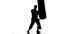 Silhouette karate man practicing on the sandbag on