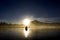 Silhouette Of Kayaker At Sunrise