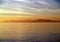 Silhouette of kayaks on water with clouds