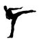 silhouette of a kickboxer athlete kicking action pose.