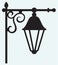 Silhouette lamp of wrought metal