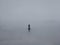 silhouette landscape the man walking alone man through misty fog.