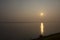 Silhouette landscape riverside and reflection light surface water of Mekhong River and lighting of Sun in morning at Mukdahan,