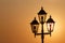 Silhouette of lantern against rising sun