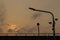 Silhouette LED Light poles and cctv on an Expressway with orange