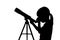 Silhouette of little girl looking through a telescope