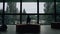 Silhouette lonely little boy walking in dark school hall with panoramic window.