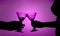 Silhouette of a love couple proposing a toast.
