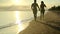Silhouette love couple running together on the beach with sunset view. Romantic and relaxing on summer