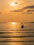 Silhouette of a lovely couple on a canoe boat during sunset