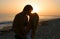 Silhouette Lovers Kissing on tne Beach