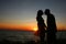 Silhouette of a loving couple against the sky after sunset