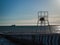 Silhouette of a loving couple on a lifeguard tower on the beach