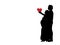 Silhouette loving husband gives heart beloved pregnant wife.