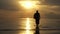 Silhouette of Male Backpacker Walking by the Sea at Sunset