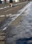 Silhouette of male jogger running on winter city bicycle lanes