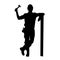 silhouette of a male labour in heavy duty costume holding hammer.