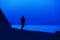 Silhouette of a male photographer by the sea