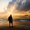 Silhouette of a man with a backpack at sunrise