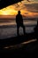 Silhouette of a man at the beach during a beautiful sunset. Olympic National Park, Washington.