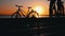 Silhouette of a Man on a Bicycle at Sunset Alone