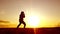 Silhouette of man exercising thai boxing. Silhouette of martial arts man training boxing on the beach over beautiful sunset backgr