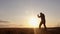 Silhouette of man exercising thai boxing. Silhouette of martial arts man training boxing on the beach over beautiful sunset backgr