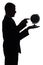 Silhouette of man with globe - pointing