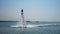 Silhouette of a Man Having Fun on Flyboard in the Sea.