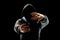 Silhouette of a man in a hood on a black background, his face is not visible, the hacker is holding the phone in his hands. The