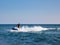 Silhouette of man on jetski at sea