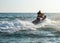 Silhouette of man on jetski at sea