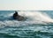 Silhouette of man on jetski at sea